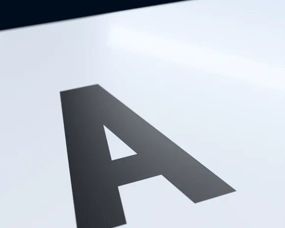 Close-up of a standard character printed flat on a white plate