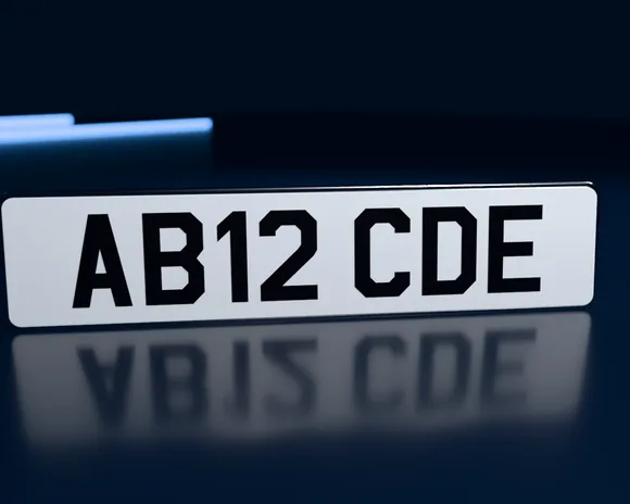A standard white number plate reading AB12 CDE
